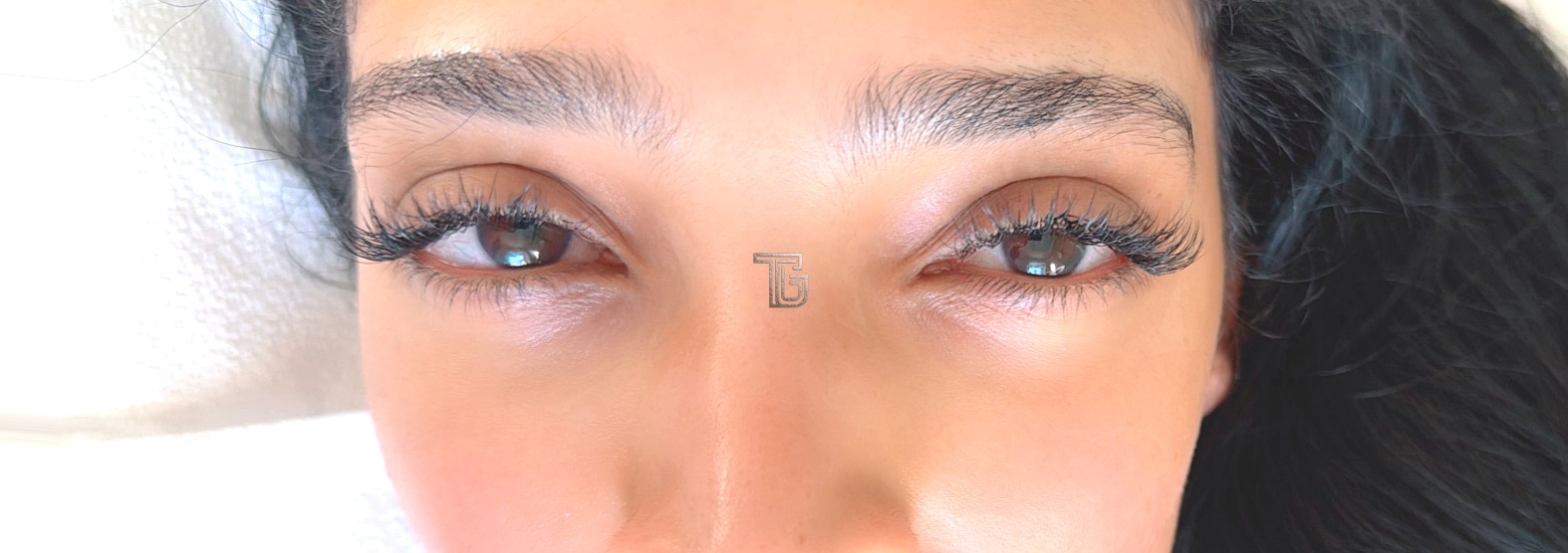 Finished cat-eye Extra Full lash set on both eyes, eyes open, with longer outer corners