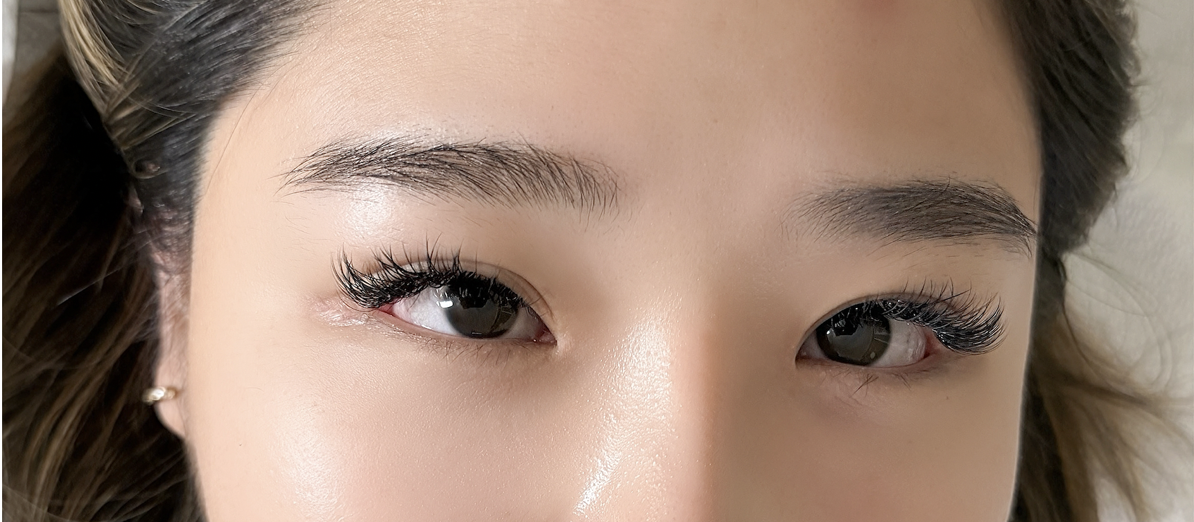 Close-up detail of cat-eye lash extension styling highlighting outer corner taper